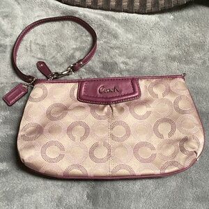 Coach plum and tan colored Wristlet bag purse